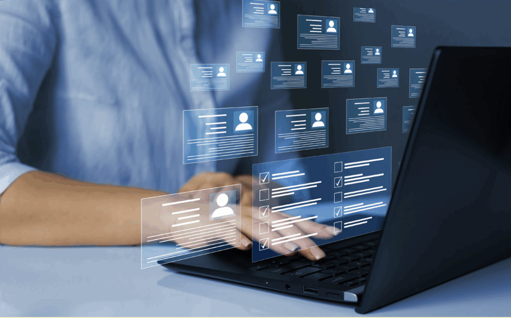 Stock Image of person typing on a laptop with information appearing as an overlay on the image